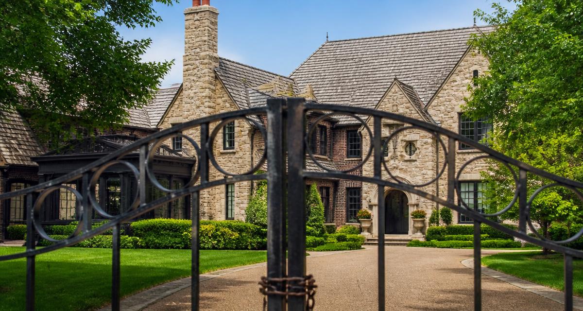 Missouri home behind a closed wrought iron gate